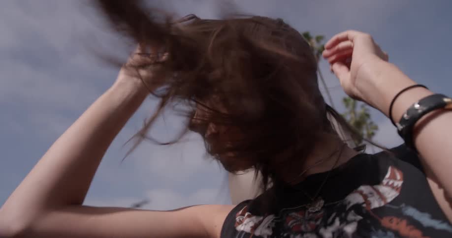 A woman is dancing in a car