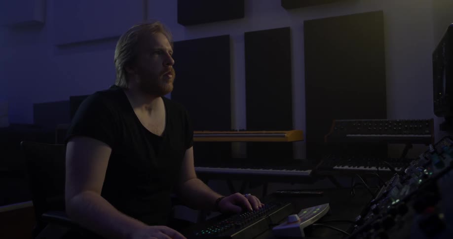 A man working on music in a studio