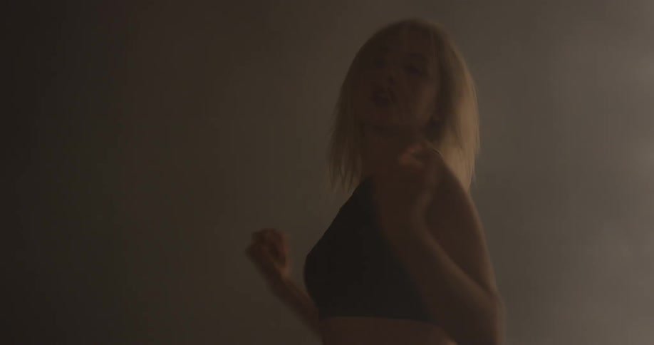 A woman swinging her arms in an expressive dance