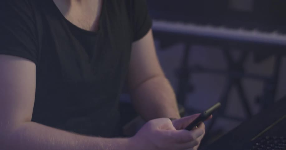 A man looking at some things on his phone