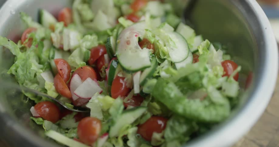 A salad is in a bowl