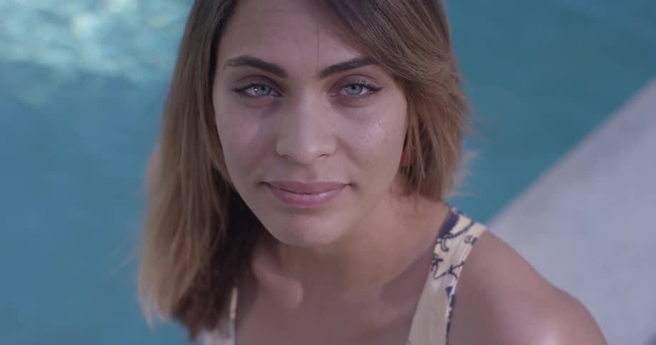 Woman Relaxing By The Pool