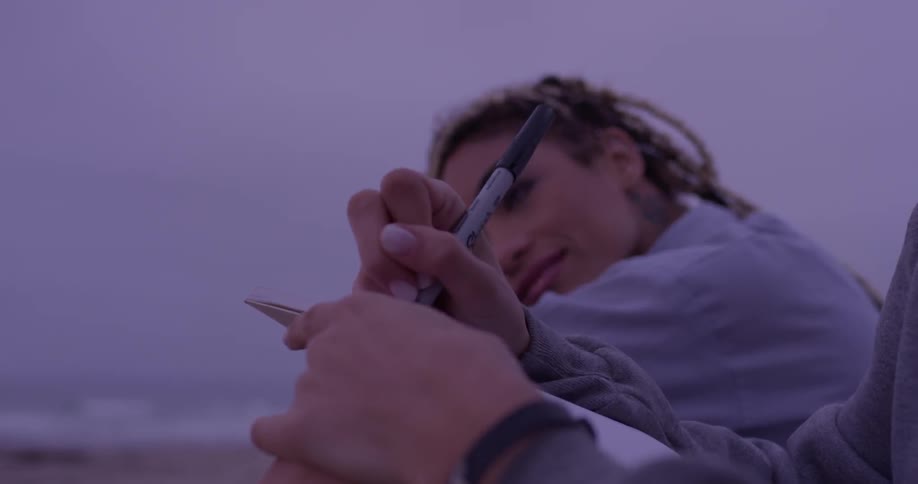 A person writing in a book