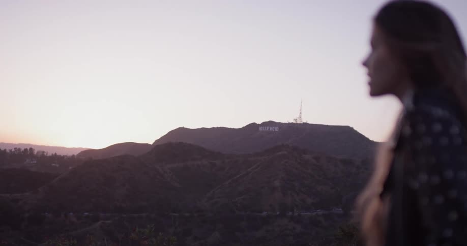 Woman Looking At Scenic View At Sunset