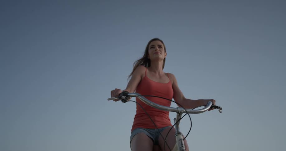 Woman rides a bike in the city