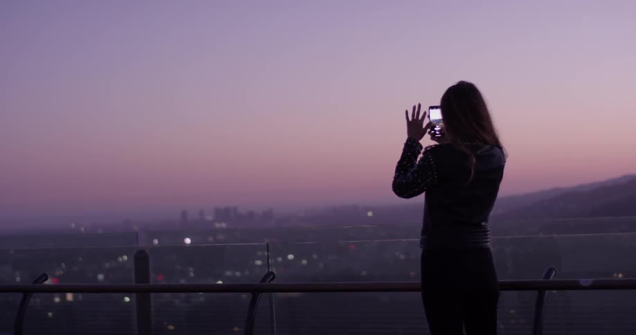 Woman Looking At Scenic View At Sunset