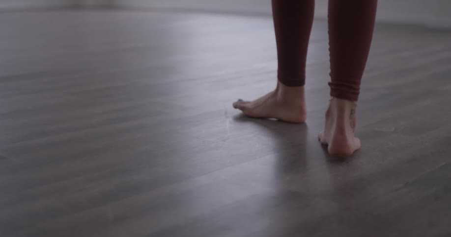 Woman Doing Yoga In Empty Building