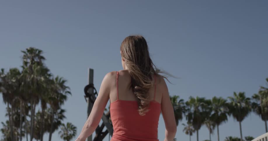 A woman is riding a bicycle outside
