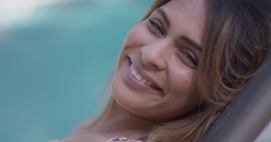 A woman laying down smiles