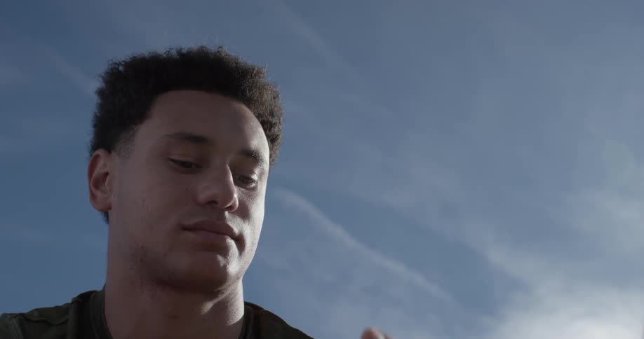 A man taking headphones out of his ears