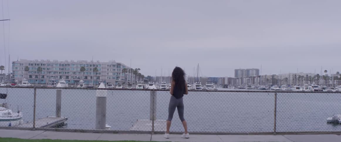 A woman is jogging in the city