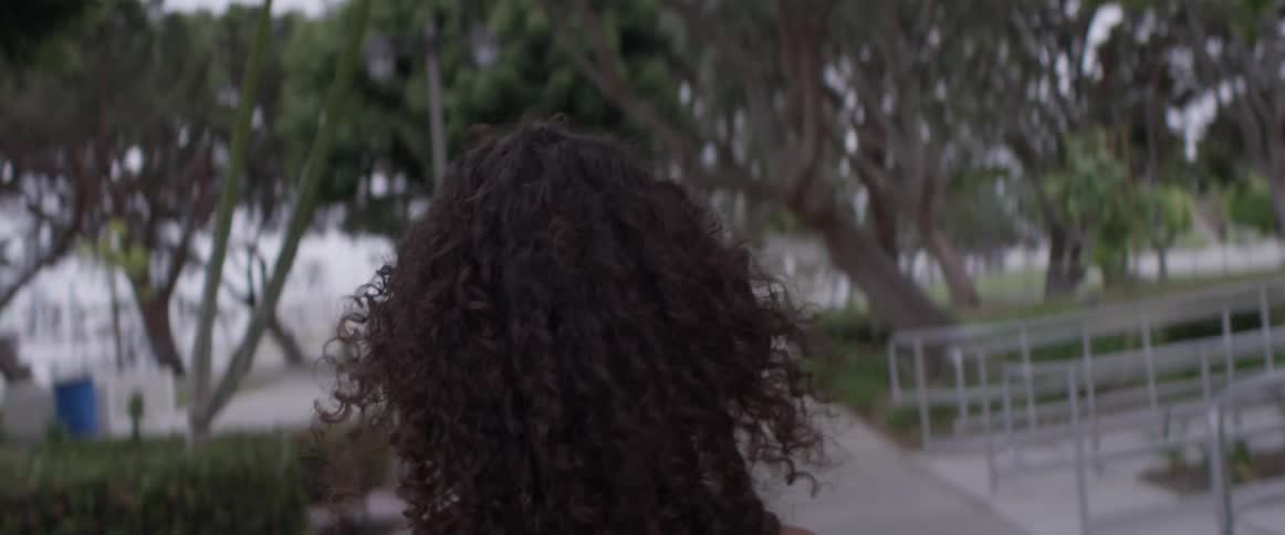 Woman walks outside in the park