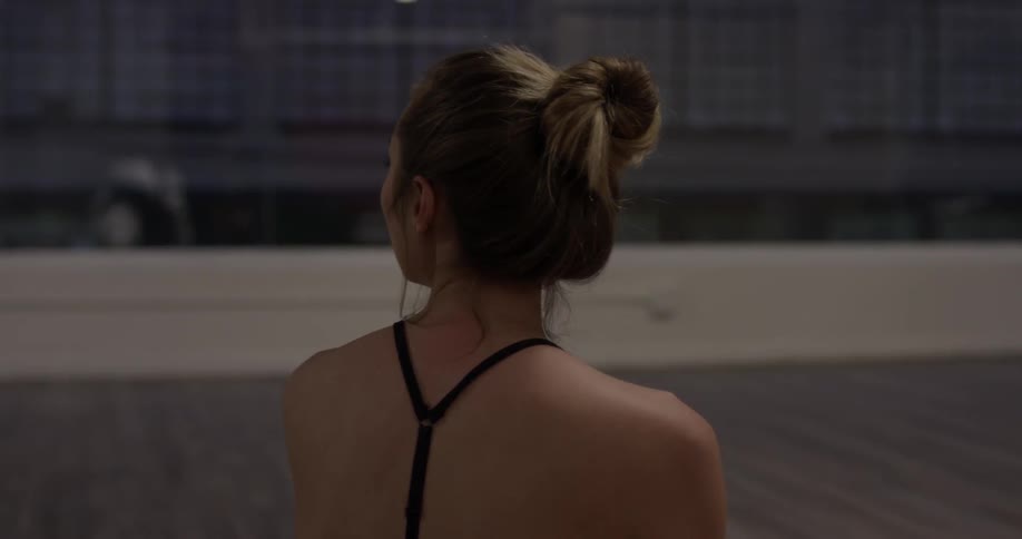 Woman Doing Yoga In Empty Building