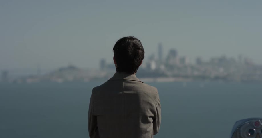 Man looking at a city in the distance