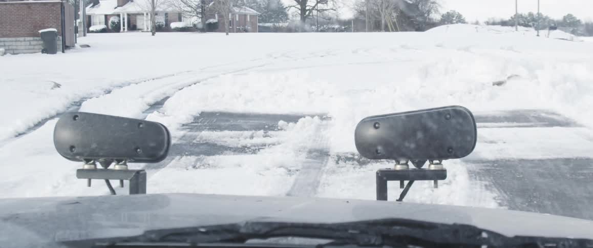 First person view of driving on a snow-covered road