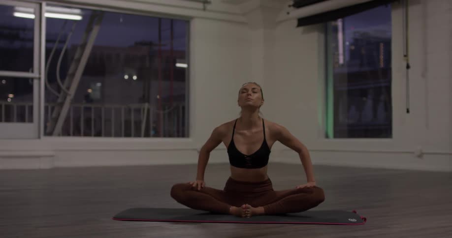 Woman doing yoga in a studio