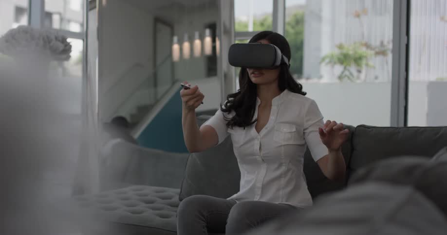 Woman In Apartment Using Electronics