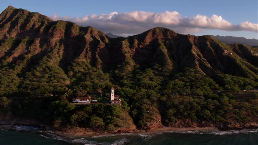 House near water in the front and mountains in the back