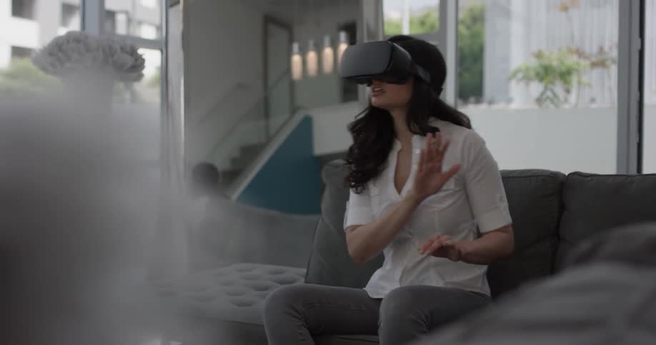 Woman In Apartment Using Electronics