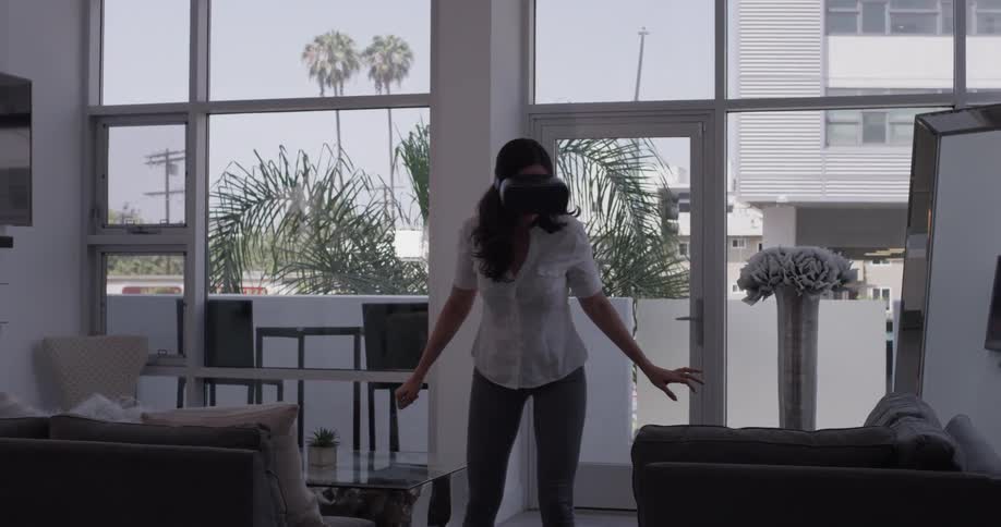 A woman is playing video games indoors