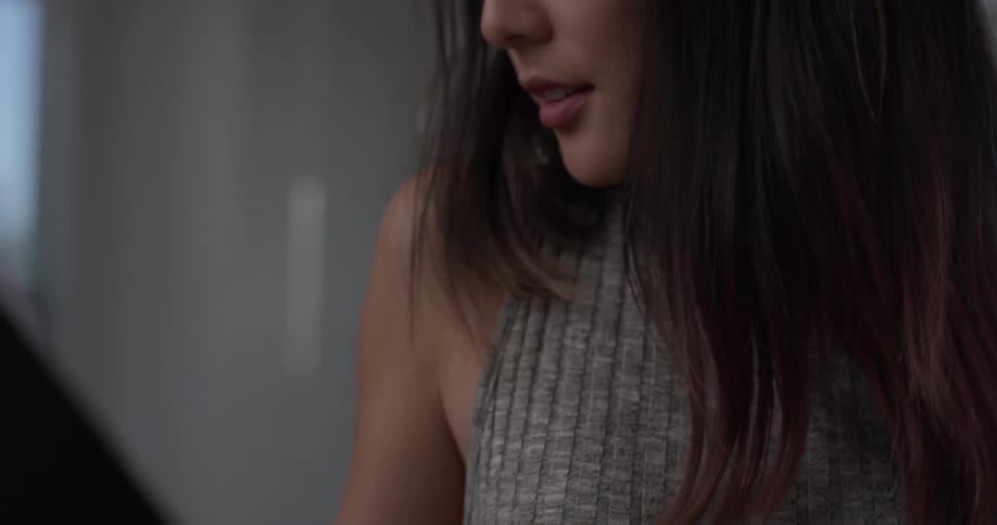 Woman looks down at stand
