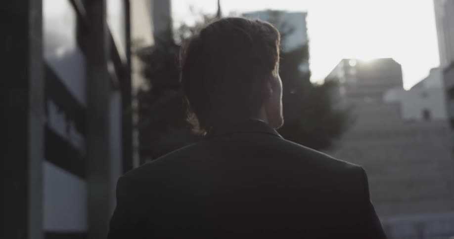 Man walks through a city during the day