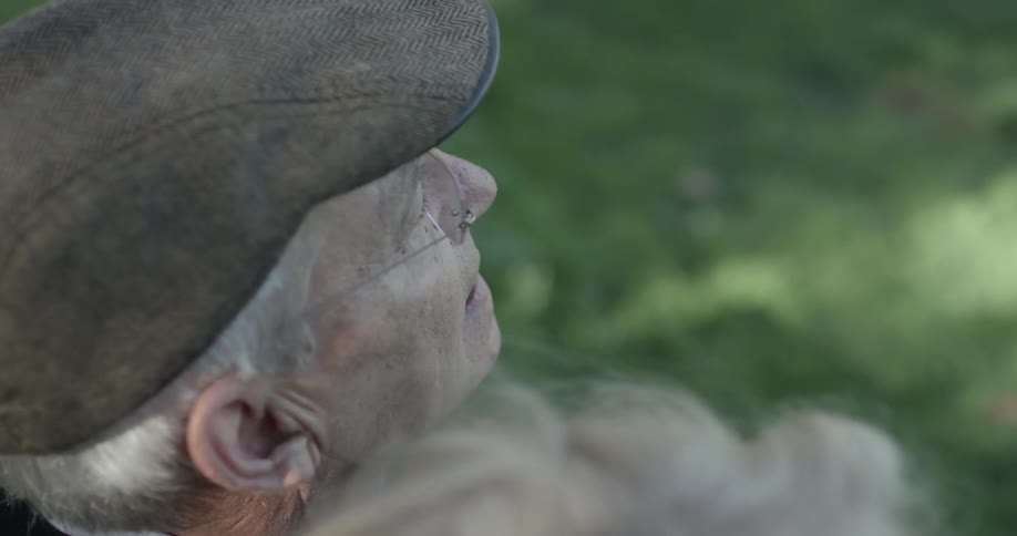 Older man sitting and looking out