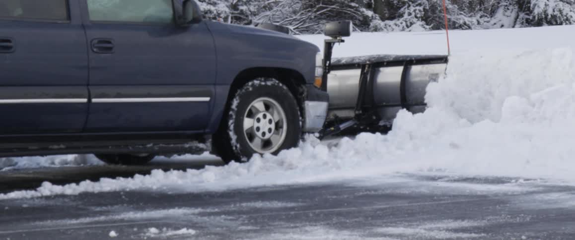 A snow plow moving snow