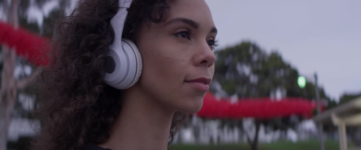A woman wearing a pair of headphones