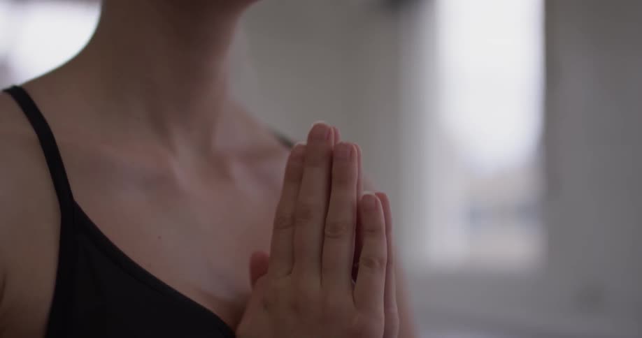 Woman meditates in an empty room
