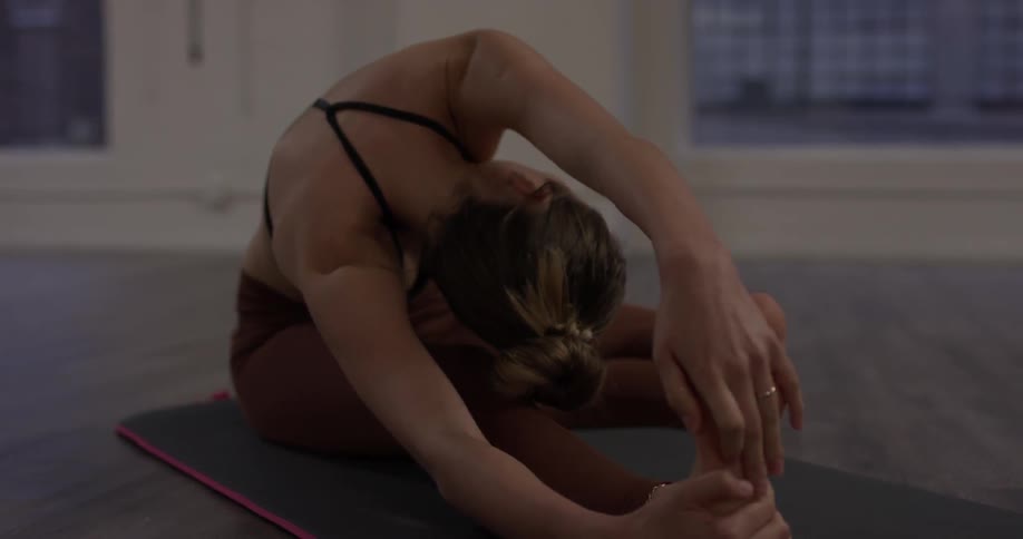 Woman Doing Yoga In Empty Building