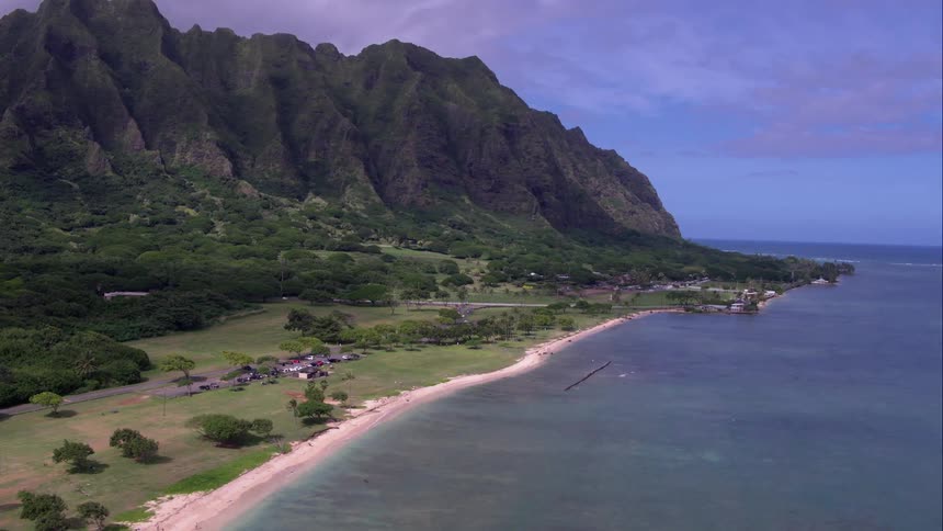 Coastal rural community with mountains and trees