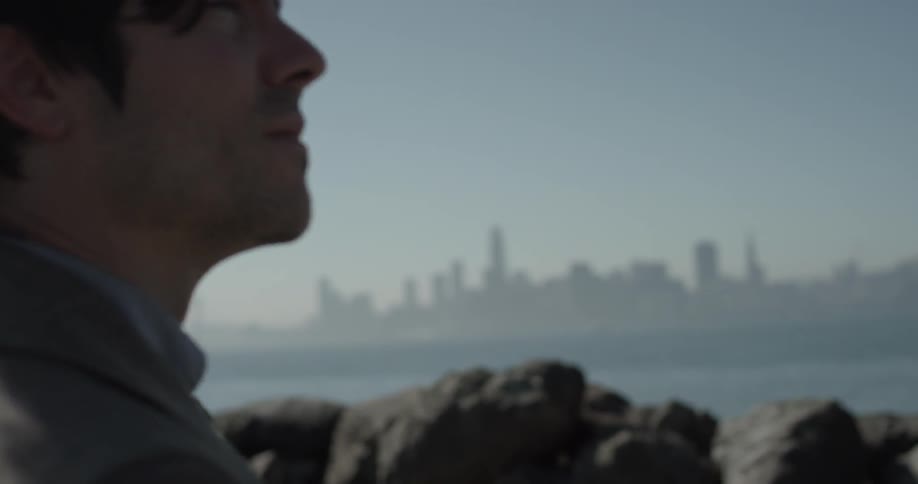 Man looking into the sky in the distance