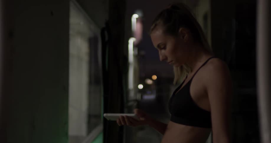 A woman scrolling through her cell phone