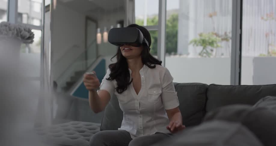Woman In Apartment Using Electronics