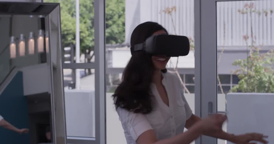 A woman is wearing a virtual reality set