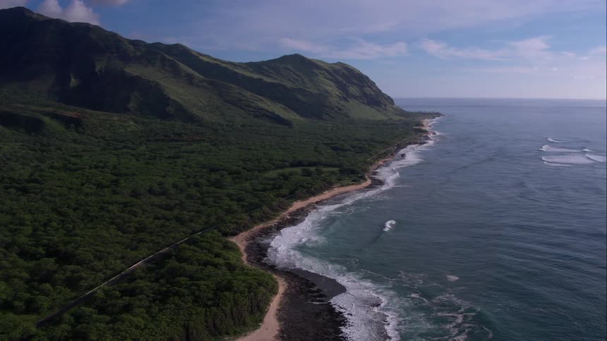 Aerial view of a mountainous coastal area during the daytime