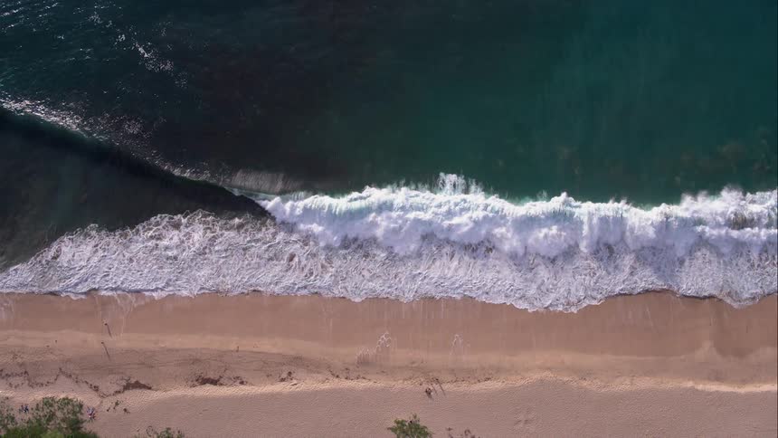 Waves crash on beach