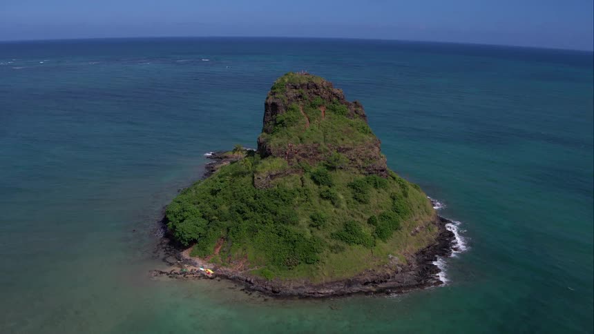 Aerial shot of an island in the middle of the ocean