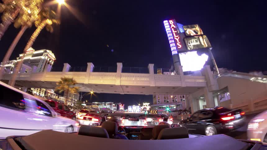 Car fast motion drives through a city