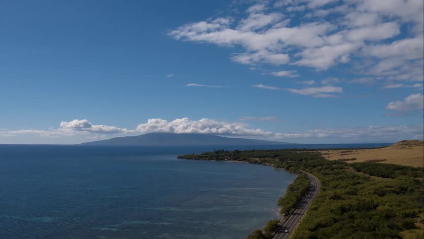 Road winds around a large body of water