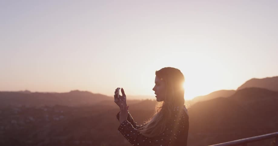 Woman Looking At Scenic View At Sunset