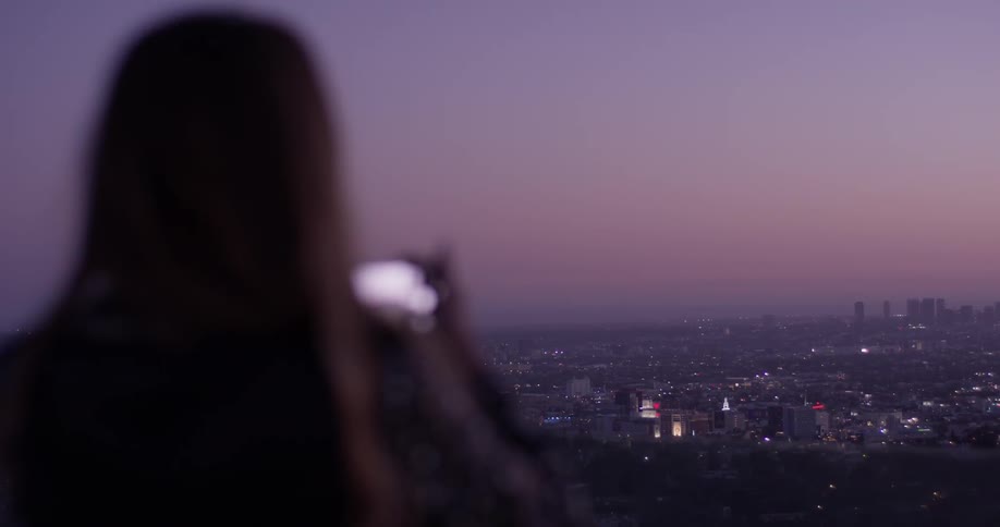Woman Looking At Scenic View At Sunset