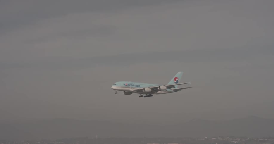 Airplane flies through clouds in dark weather