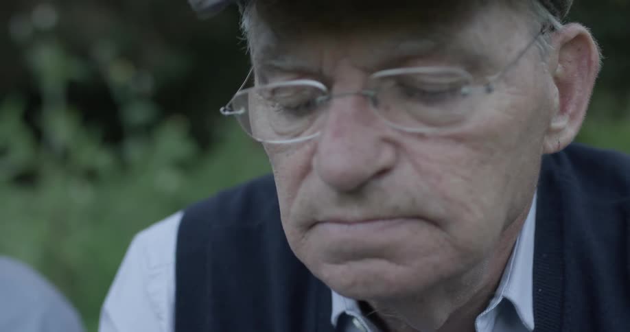 Close up of old man with glasses