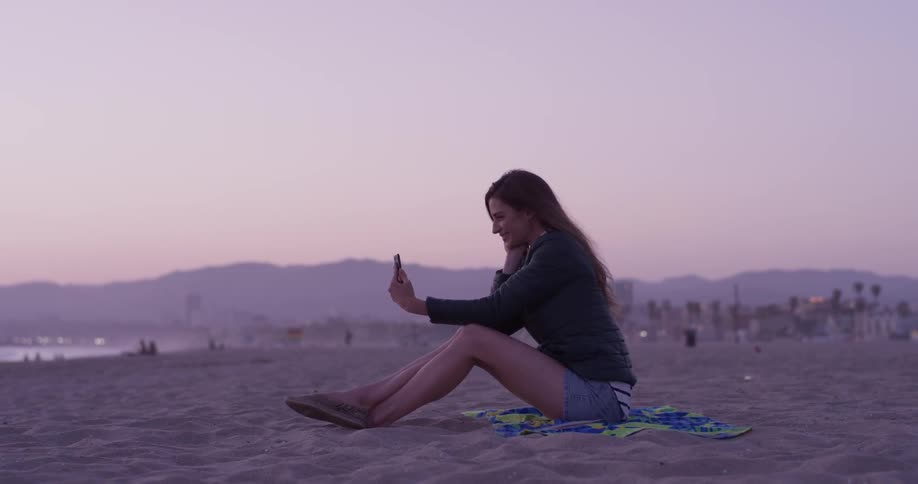 Woman taking a selfie on her phone