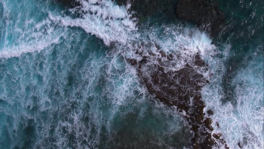 Waves crash onto a rocky shore
