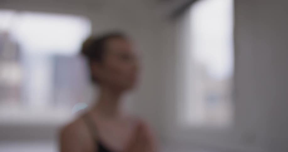 Woman Doing Yoga In Empty Building