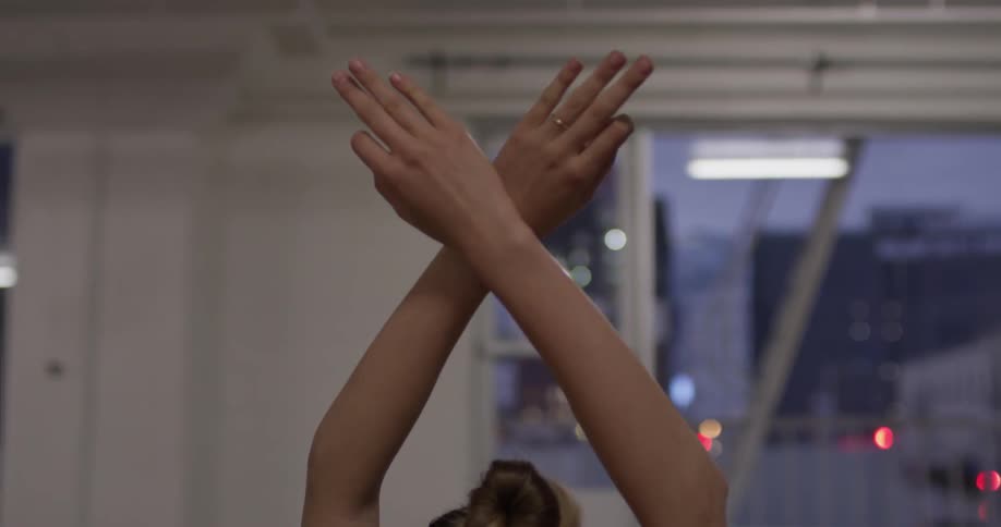 Woman Doing Yoga In Empty Building