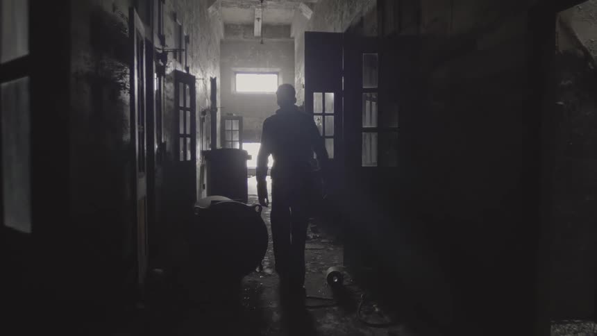 A person walking down a hallway